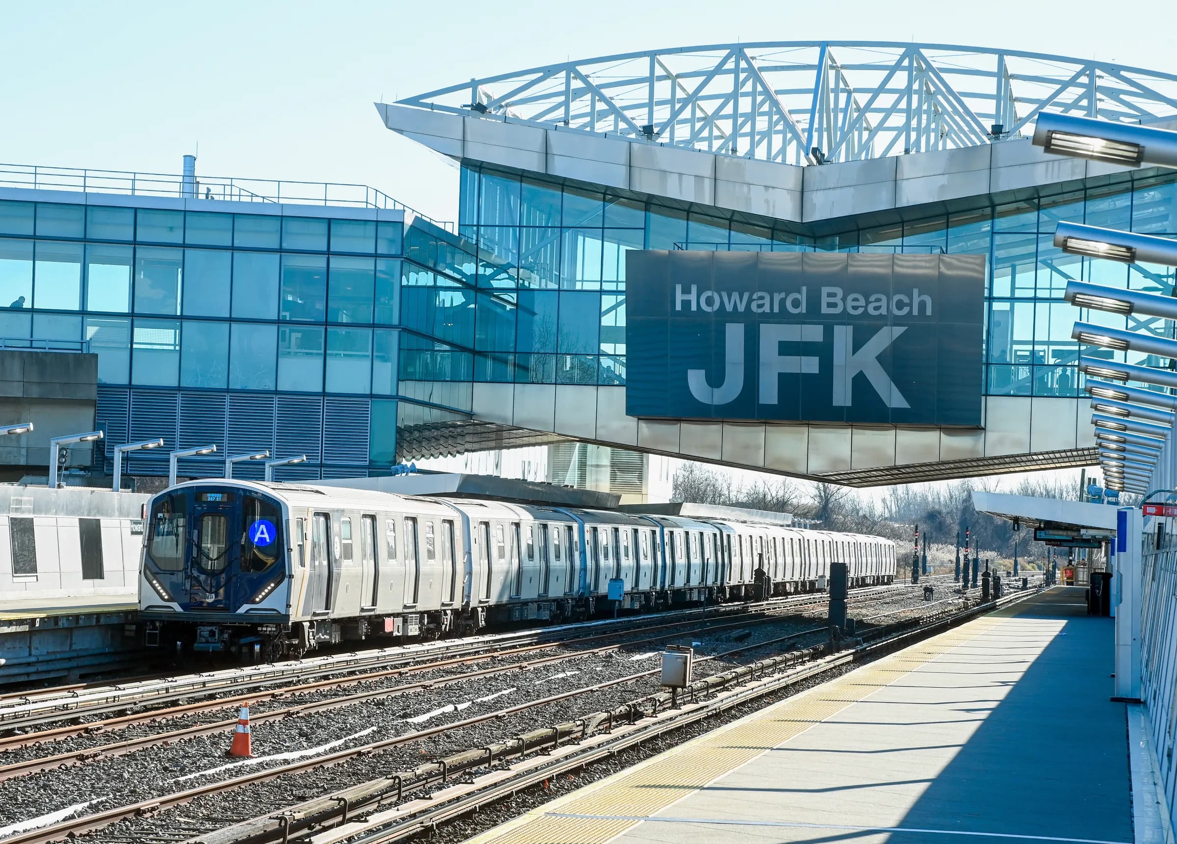 A renovated A-train station — the subway is the whole transport plan, 24 hours a day.